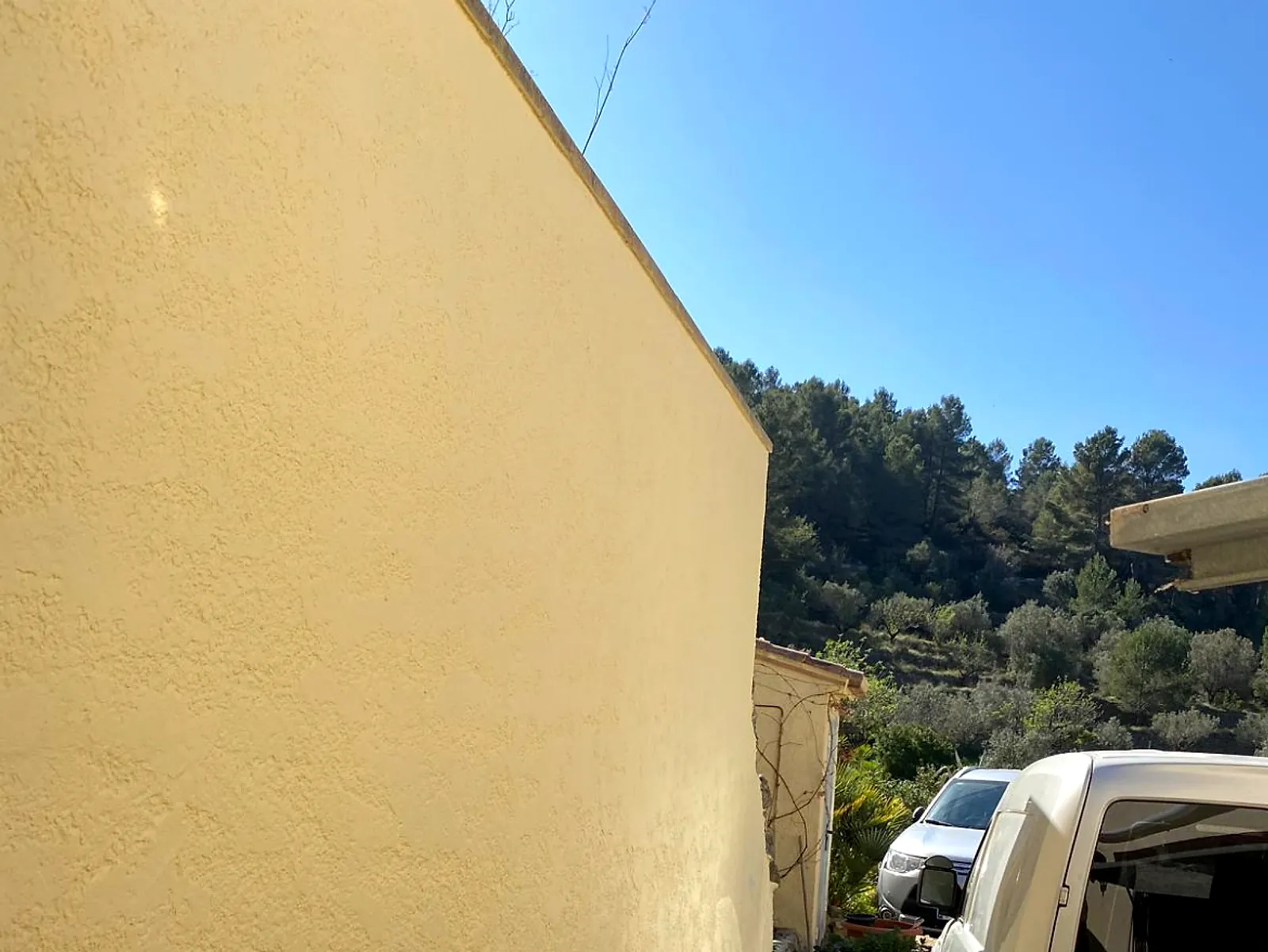 After: the same wall re-rendered with a smooth, even finish